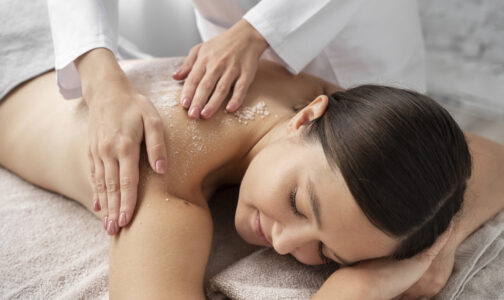 high-angle-woman-getting-massaged-spa